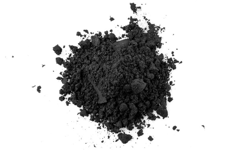 A pile of black manganese powder viewed from top down.