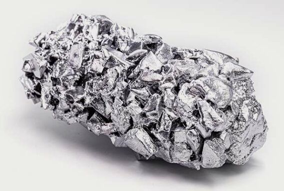 A chunk of refined titanium ore on a white background.