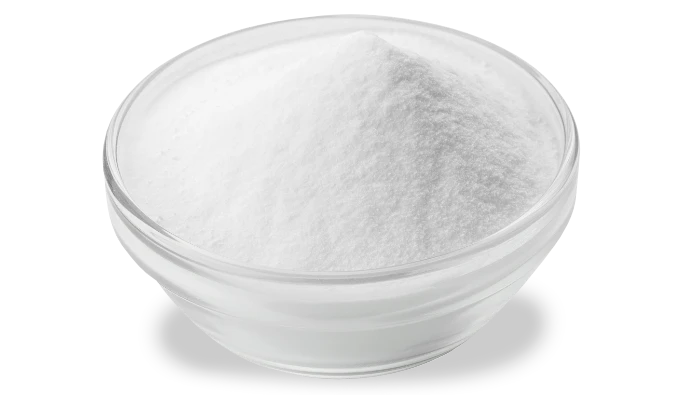 White boron nitride powder in a glass dish on a white background.