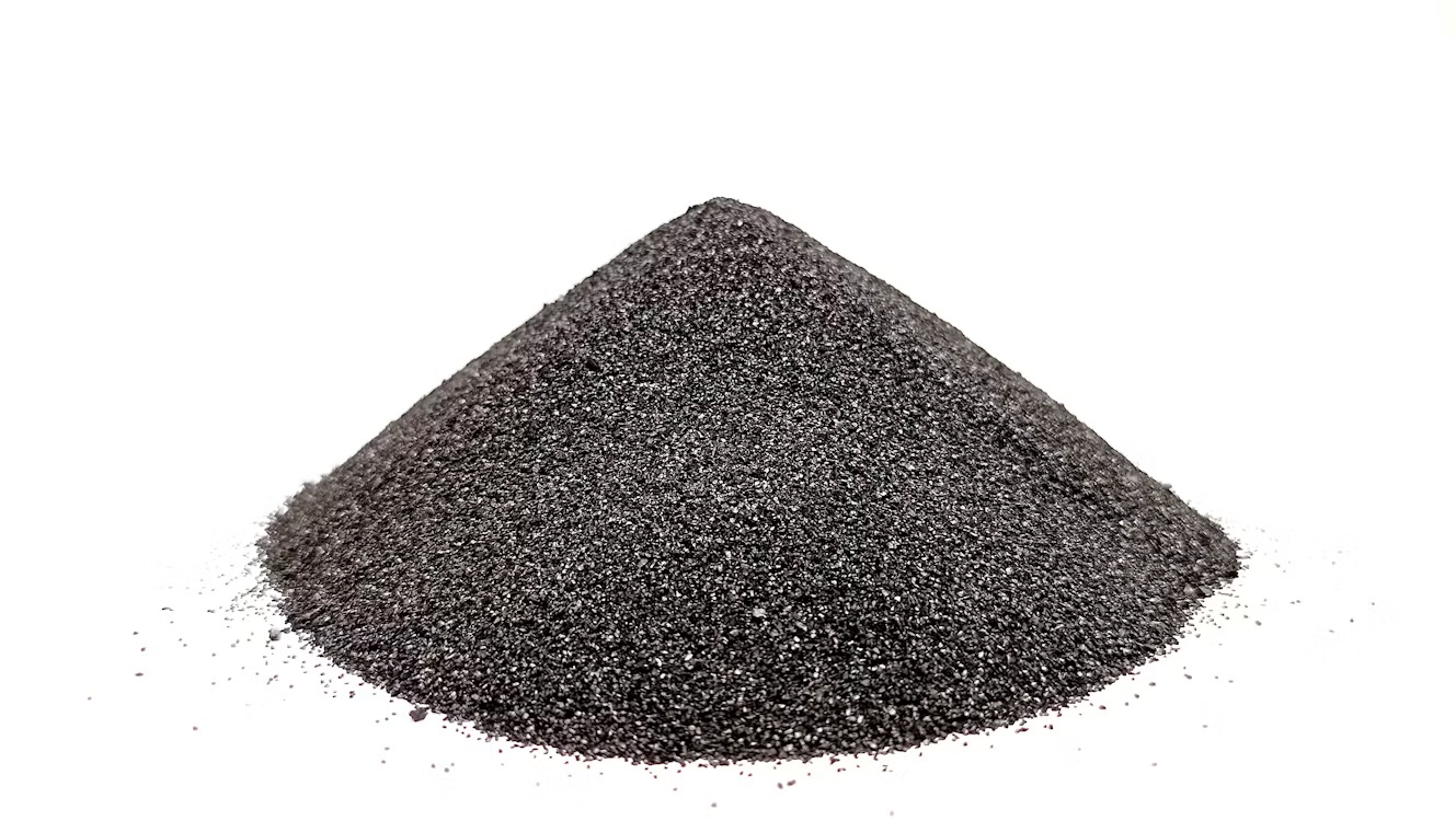 Conical pile of dark gray iron powder on a white background.